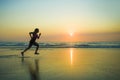 Silhouette of young happy and attractive African American runner woman exercising in running fitness sprint workout at beautiful b Royalty Free Stock Photo