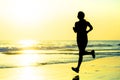 Silhouette of young happy and attractive African American runner woman exercising in running fitness workout at beautiful beach jo Royalty Free Stock Photo