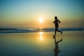 Silhouette of young happy and attractive African American runner woman exercising in running fitness workout at beautiful beach jo Royalty Free Stock Photo