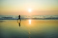 Silhouette of young happy and attractive African American runner woman exercising in running fitness workout at beautiful beach jo Royalty Free Stock Photo