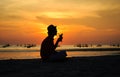 Silhouette of young man drinking cocktail at