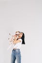 Young girl with his dog at studio. Young owner hugs his pet. young and beautiful girl holding her dog in her arms with Royalty Free Stock Photo