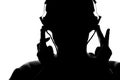 Silhouette of a young man listening to music with headphones Royalty Free Stock Photo