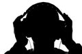 Silhouette of a young man listening to music with headphones Royalty Free Stock Photo