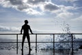 Silhouette of young man standing at the seaside Royalty Free Stock Photo