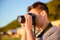 Silhouette of young photographer on the beach Royalty Free Stock Photo