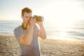 Silhouette of young photographer on the beach Royalty Free Stock Photo