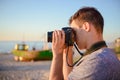 Silhouette of young photographer on the beach Royalty Free Stock Photo