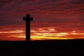Silhouette of Young Ralph Cross against magnificent orange and red sunset, Westerdale, North York Moors National Park