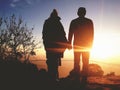 Silhouette of Young Romantic Couple Holding Hands at Amazing Golden Sunset. Carefree Travel Lyfestyle Relationship Royalty Free Stock Photo