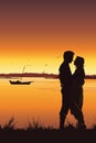 Silhouette of young romantic couple on sunset background Royalty Free Stock Photo
