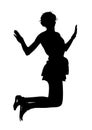 Silhouette of a young slender skinny girl who is having fun jumping up