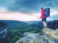 Silhouette of young tourist guide looking in map on trail Royalty Free Stock Photo