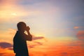 Silhouette of a young travel and photography