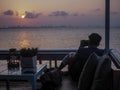 Silhouette of a young who like to travel and photographer, taking pictures of the beautiful moments during the sunset ,sunrise Royalty Free Stock Photo