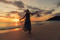 Silhouette young woman on the beach at sunset Royalty Free Stock Photo