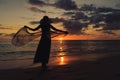 Silhouette young woman on the beach at sunset Royalty Free Stock Photo