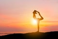 Silhouette of young woman with clipping path practicing yoga relaxing exercise on the mountain top sunset at the beach Royalty Free Stock Photo