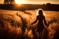 Silhouetted Young Woman Walks Into Beautiful Sunset Royalty Free Stock Photo
