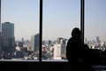 Silhouette of young woman in front of skyline