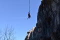 Young woman during bungee jump in cave Royalty Free Stock Photo