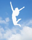 Silhouette of young woman jumping and cheering, arms in the air Royalty Free Stock Photo