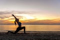 Silhouette young woman lifestyle exercising vital meditate and practicing yoga ball on the beach Royalty Free Stock Photo