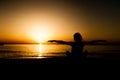 Silhouette young woman practicing yoga Royalty Free Stock Photo