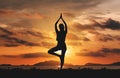 Silhouette young woman practicing yoga on the beach in sunset Royalty Free Stock Photo