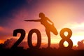 Silhouette young woman practicing yoga on 2018 new year Royalty Free Stock Photo