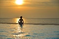 Silhouette young woman practicing yoga on swimming pool Royalty Free Stock Photo