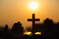 Silhouette of young woman praying with crosses and bibles at sunrise, Christian Religion concept background Royalty Free Stock Photo