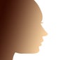 Silhouette of a young woman`s head in profile, with gradient of warm skin tones, as a concept of feminism, equality and women
