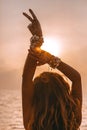 Silhouette of young woman showing victory with her fingers Royalty Free Stock Photo
