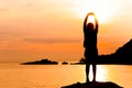 Silhouette of young woman standing at relax pose or freedom pose or chill pose Royalty Free Stock Photo
