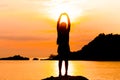 Silhouette of young woman standing at relax pose or freedom pose or chill pose Royalty Free Stock Photo