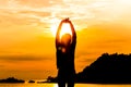 Silhouette of young woman standing at relax pose or freedom pose or chill pose Royalty Free Stock Photo