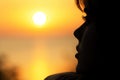 Silhouette of a young woman at sunset Royalty Free Stock Photo