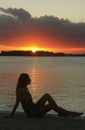 Silhouette of young woman at sunset, Boca Chica bay Royalty Free Stock Photo