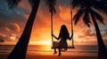 Silhouette of a young woman on a swing on a palm tree by the beach during sunset Royalty Free Stock Photo