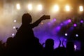 Silhouette of Young Woman Taking Selfie Picture Using her Smartphone