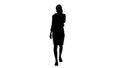 Silhouette Young woman wearing Protective Face Mask making a call walking. Royalty Free Stock Photo