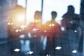 Silhouette of young workers in the office with statistic worksheets. concept of teamwork and business. double exposure