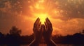 Hands praying to orange sunset sky Royalty Free Stock Photo