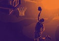 Silhouetted basketball player executing a dynamic Royalty Free Stock Photo