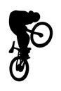 Silhouetted BMX rider on bike