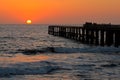 Silhouetted coastal pier Royalty Free Stock Photo