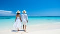 Silhouetted couple enjoying sunny summer day at beach with sparkling blue ocean waves