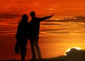 Silhouetted couple at sunset