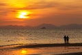 Silhouetted of couple, sweet in the beach at Krabi, Thailand.